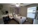Bedroom with a queen bed and leafy wall decor at 4410 Summer Savory St, Tampa, FL 33619