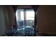 Glass dining table with lake view from sliding glass doors at 4410 Summer Savory St, Tampa, FL 33619