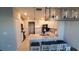 Modern kitchen with white cabinets, granite countertops, and stainless steel appliances at 4410 Summer Savory St, Tampa, FL 33619
