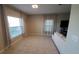 Bright living room featuring a sectional sofa and large windows at 4410 Summer Savory St, Tampa, FL 33619