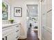 White bathroom vanity with view of bedroom and hallway at 526 19Th Ne Ave, St Petersburg, FL 33704