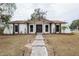 Newly renovated single-story home with a modern facade and landscaped lawn at 602 Briarcliff Dr, Valrico, FL 33594