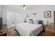 Spacious main bedroom with ensuite bathroom and a ceiling fan at 6327 S Renellie Ct, Tampa, FL 33616