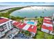Aerial view showing the property, pool, and waterfront at 6365 Bahia Del Mar Blvd # 604, St Petersburg, FL 33715
