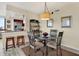Small dining area with a glass-top table and four chairs at 6365 Bahia Del Mar Blvd # 604, St Petersburg, FL 33715
