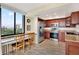 Modern kitchen with stainless steel appliances and wood cabinets at 6365 Bahia Del Mar Blvd # 604, St Petersburg, FL 33715