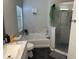 Bathroom with soaking tub, separate shower, and granite countertop at 6905 Sotra St, Wesley Chapel, FL 33545