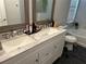 Double vanity bathroom with granite countertop, and a toilet at 6905 Sotra St, Wesley Chapel, FL 33545