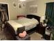 Main bedroom with dark wood furniture and closet at 6905 Sotra St, Wesley Chapel, FL 33545