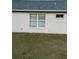 Rear view of house showcasing simple exterior at 6905 Sotra St, Wesley Chapel, FL 33545