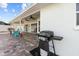 Paver patio area with covered area, ceiling fans, and outdoor grill at 731 Brittany Park Blvd, Tarpon Springs, FL 34689