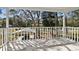 White-railed balcony overlooking a tree-lined street at 7803 Cadillac Ave, Hudson, FL 34667