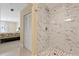 Modern bathroom with a large marble shower at 7803 Cadillac Ave, Hudson, FL 34667