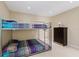 Bedroom with a bunk bed and dresser at 7803 Cadillac Ave, Hudson, FL 34667