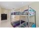 Bedroom with a metal bunk bed at 7803 Cadillac Ave, Hudson, FL 34667