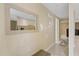 Bright entryway with mirror reflecting kitchen at 7803 Cadillac Ave, Hudson, FL 34667