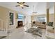 Spacious living room with a fireplace and tiled floors at 7803 Cadillac Ave, Hudson, FL 34667