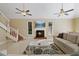 Spacious living room with fireplace and high ceilings at 7803 Cadillac Ave, Hudson, FL 34667