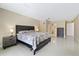 Spacious main bedroom with ensuite bathroom and tiled floors at 7803 Cadillac Ave, Hudson, FL 34667