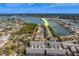 Aerial view of a waterfront townhouse community near the coast, highlighting the property at 905 Hidden Harbour Dr, Indian Rocks Beach, FL 33785