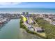 Aerial view of waterfront property, showing community pool and ocean access at 905 Hidden Harbour Dr, Indian Rocks Beach, FL 33785