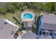 Aerial view of community pool and surrounding homes at 905 Hidden Harbour Dr, Indian Rocks Beach, FL 33785