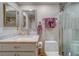 Clean bathroom with a shower/tub combo, vanity with granite countertop at 905 Hidden Harbour Dr, Indian Rocks Beach, FL 33785