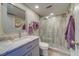 Bathroom with a walk-in shower, vanity with marble countertop at 905 Hidden Harbour Dr, Indian Rocks Beach, FL 33785