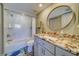 Bathroom with a shower/tub combo, vanity with granite countertop at 905 Hidden Harbour Dr, Indian Rocks Beach, FL 33785