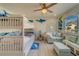 bedroom with bunk beds, sofa and coastal decor at 905 Hidden Harbour Dr, Indian Rocks Beach, FL 33785