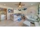 Bunk beds and a sofa in a bedroom featuring marine life decor at 905 Hidden Harbour Dr, Indian Rocks Beach, FL 33785