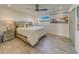 Main bedroom with a king-size bed and coastal decor at 905 Hidden Harbour Dr, Indian Rocks Beach, FL 33785