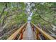 Wooden boardwalk leads to private dock on calm water at 905 Hidden Harbour Dr, Indian Rocks Beach, FL 33785