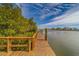 Wooden dock with scenic waterfront views at 905 Hidden Harbour Dr, Indian Rocks Beach, FL 33785