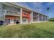 Back exterior of property with multiple units and decks at 905 Hidden Harbour Dr, Indian Rocks Beach, FL 33785