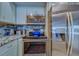 Stainless steel appliances and granite countertops in this updated kitchen at 905 Hidden Harbour Dr, Indian Rocks Beach, FL 33785