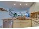 Open kitchen with granite island, stainless steel appliances, and breakfast bar at 905 Hidden Harbour Dr, Indian Rocks Beach, FL 33785