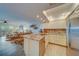 Open concept kitchen with granite countertops and stainless steel appliances at 905 Hidden Harbour Dr, Indian Rocks Beach, FL 33785