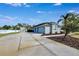 House with detached garage and landscaped yard at 9413 Swift Creek Cir, Dover, FL 33527