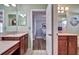 Double vanity bathroom with spacious countertops and a view to the bedroom at 9413 Swift Creek Cir, Dover, FL 33527