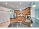 Spacious kitchen with island, stainless steel appliances, and granite countertops at 9413 Swift Creek Cir, Dover, FL 33527