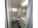 Clean bathroom, shower/tub combo, vanity, and tile flooring at 9608 41St N St # 2, Pinellas Park, FL 33782