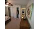 Bedroom with double bed, built-in closets, and access to hallway at 9608 41St N St # 2, Pinellas Park, FL 33782