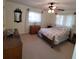 Spacious bedroom with a queen-size bed and dresser at 9608 41St N St # 2, Pinellas Park, FL 33782