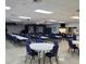 Large community hall with ample seating and tables, perfect for events at 9608 41St N St # 2, Pinellas Park, FL 33782