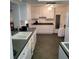 Bright kitchen with ample cabinetry and granite countertops at 9608 41St N St # 2, Pinellas Park, FL 33782