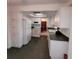 Kitchen with white cabinets, dark countertop, and stainless steel appliances at 9608 41St N St # 2, Pinellas Park, FL 33782