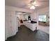 Kitchen with white cabinets, dark countertops, and access to living room at 9608 41St N St # 2, Pinellas Park, FL 33782