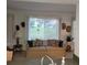 Living room with large windows, sofa, and view of backyard at 9608 41St N St # 2, Pinellas Park, FL 33782