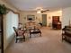 Spacious living room featuring a sofa, coffee table, and built-in hutch at 9608 41St N St # 2, Pinellas Park, FL 33782